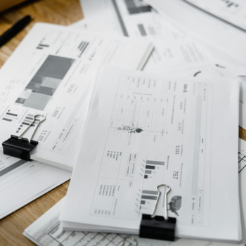 Various financial reports on top of a desk